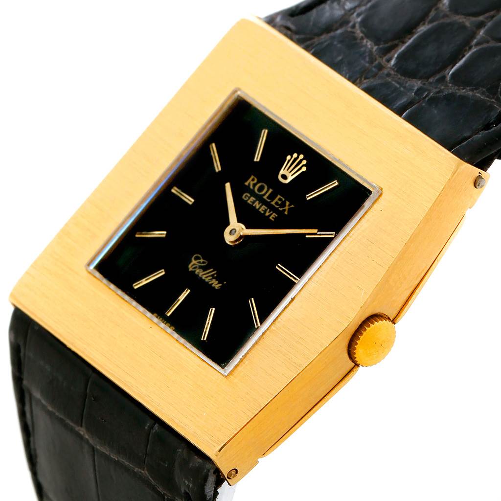 The image shows a close-up angled view of a Rolex Cellini 4017 Men's Yellow Gold Black Dial 4017 Men's Yellow Gold Black Dial watch featuring its black dial, gold case, and black strap.