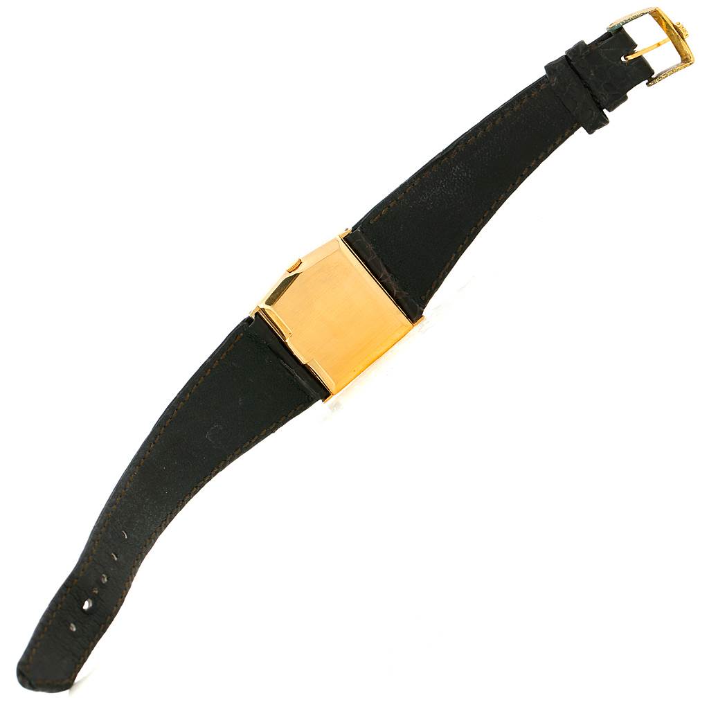 This image shows a top-down view of a Rolex Cellini 4017 Men's Yellow Gold Black Dial 4017 Men's Yellow Gold Black Dial watch, highlighting its black leather strap and gold casing.