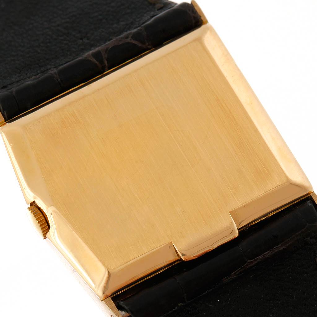 This image shows the back case and part of the black strap of the Rolex Cellini 4017 Men's Yellow Gold Black Dial 4017 Men's Yellow Gold Black Dial watch from a close-up angle.