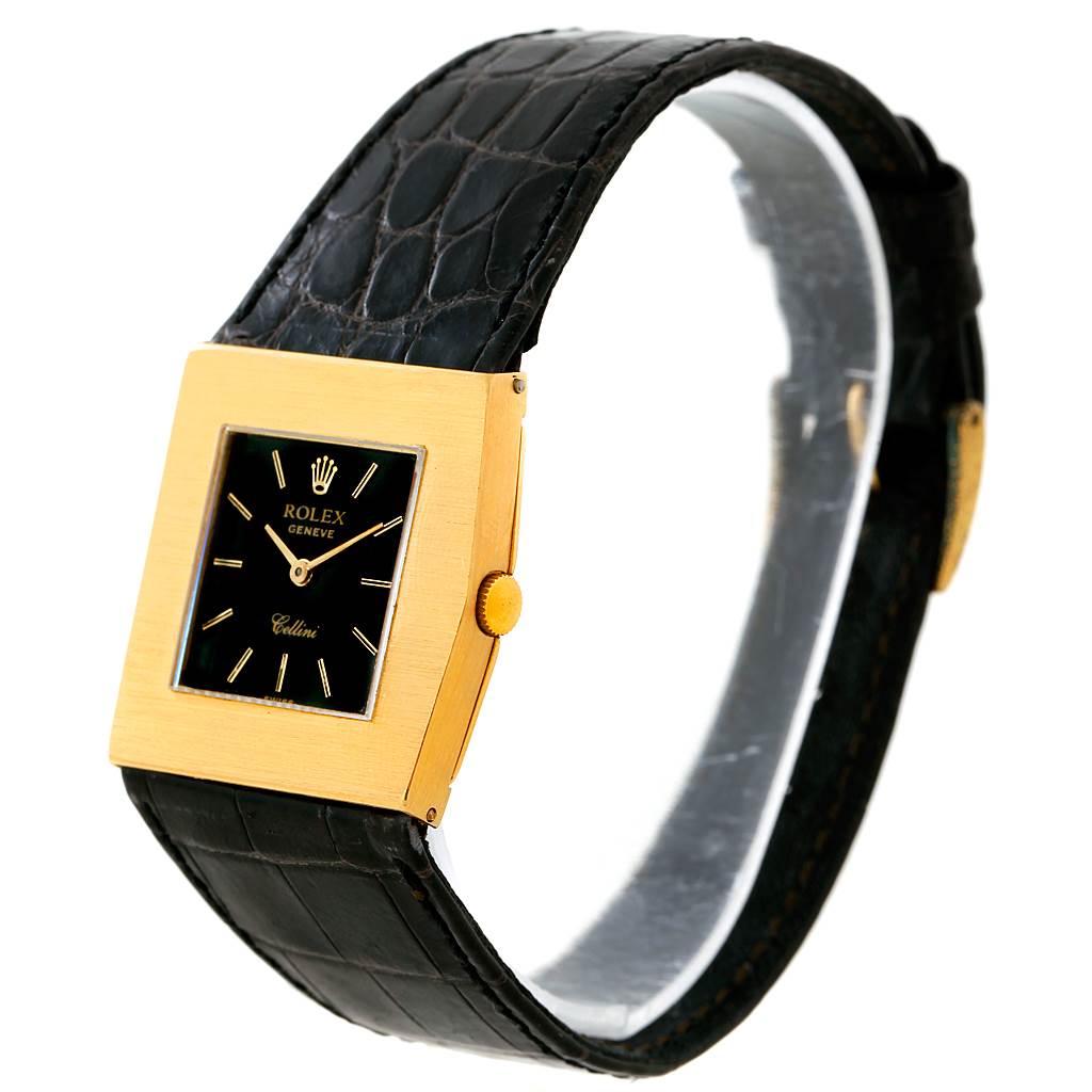 The image shows a Rolex Cellini 4017 Men's Yellow Gold Black Dial 4017 Men's Yellow Gold Black Dial watch at an angled side view, highlighting its gold square case, black dial, and black leather strap.