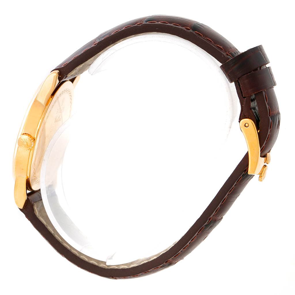 The image shows a side view of a Rolex Cellini 5116 Men's Yellow Gold Beige Dial 5116 Men's Yellow Gold Beige Dial watch, highlighting its brown leather strap and gold case.