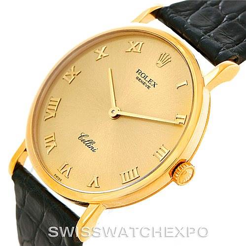 The image shows a close-up view of the face and part of the strap of a Rolex Cellini 5112 Men
s Yellow Gold Champagne Dial 5112 Men
s Yellow Gold Champagne Dial watch angled slightly to the right.