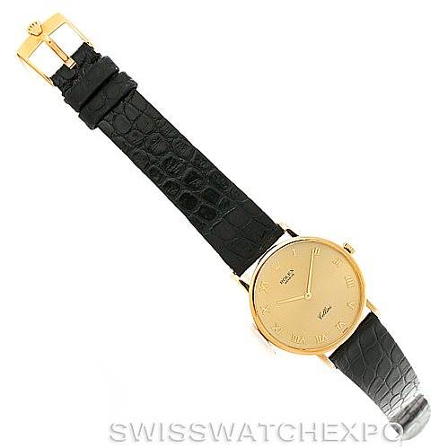 The Rolex Cellini 5112 Men
s Yellow Gold Champagne Dial 5112 Men
s Yellow Gold Champagne Dial watch is shown from an overhead angle, displaying its gold dial, black leather strap, and buckle.