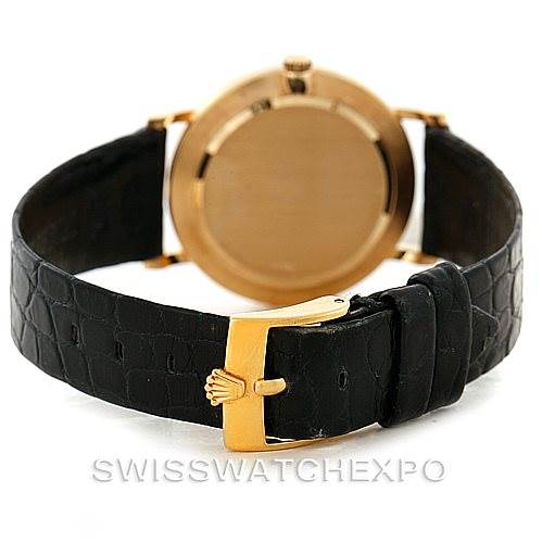 The image shows the back view of a Rolex Cellini 5112 Men
s Yellow Gold Champagne Dial 5112 Men
s Yellow Gold Champagne Dial watch highlighting the leather strap and gold clasp.