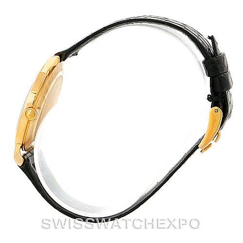 This side view of the Rolex Cellini 5112 Men
s Yellow Gold Champagne Dial 5112 Men
s Yellow Gold Champagne Dial watch shows the gold case, crown, and black leather strap.