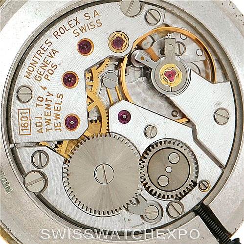 The image shows a close-up of the internal mechanical movement of the Rolex Cellini 5112 Men
s Yellow Gold Champagne Dial 5112 Men
s Yellow Gold Champagne Dial watch.