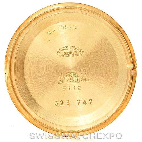 This image shows the inner side of the case back of a Rolex Cellini 5112 Men
s Yellow Gold Champagne Dial 5112 Men
s Yellow Gold Champagne Dial watch, displaying inscriptions and hallmarks.