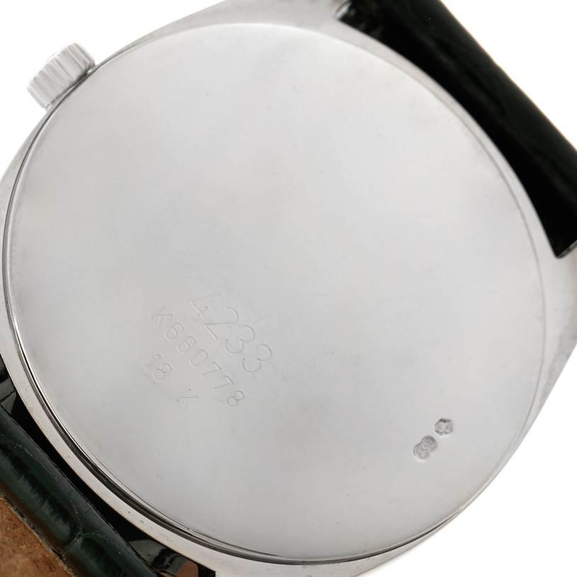 The image shows the back case of a Rolex Cellini 4233 Men's White Gold Black Dial 4233 Men's White Gold Black Dial watch, highlighting its smooth surface and engraved details.
