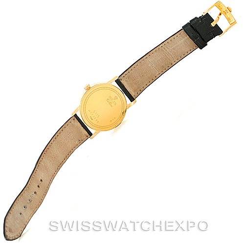 The image shows the back of a Rolex Cellini 5115 Men
s Yellow Gold Champagne Dial 5115 Men
s Yellow Gold Champagne Dial watch, highlighting the case back and leather strap with the buckle visible.