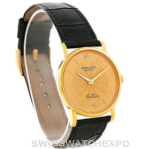 This image shows a Rolex Cellini 5115 Men
s Yellow Gold Champagne Dial 5115 Men
s Yellow Gold Champagne Dial watch angled to display the dial, case, and leather strap.