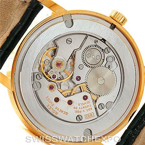 This image shows the back view of a Rolex Cellini 5115 Men
s Yellow Gold Champagne Dial 5115 Men
s Yellow Gold Champagne Dial watch, revealing the intricate movement and internal mechanism.
