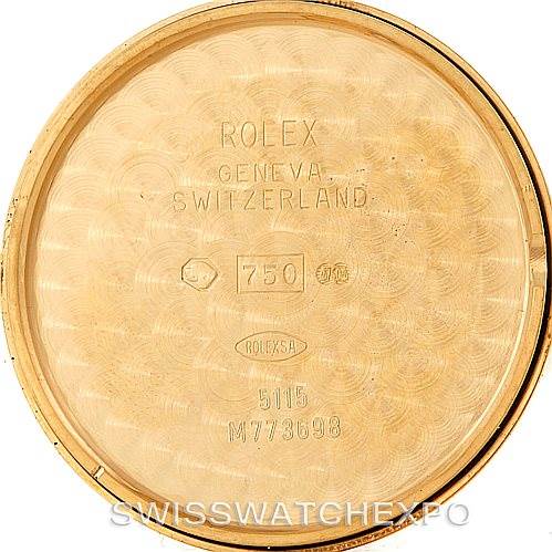 This image shows the interior of the case back of a Rolex Cellini 5115 Men
s Yellow Gold Champagne Dial 5115 Men
s Yellow Gold Champagne Dial watch, displaying engravings and hallmarks.