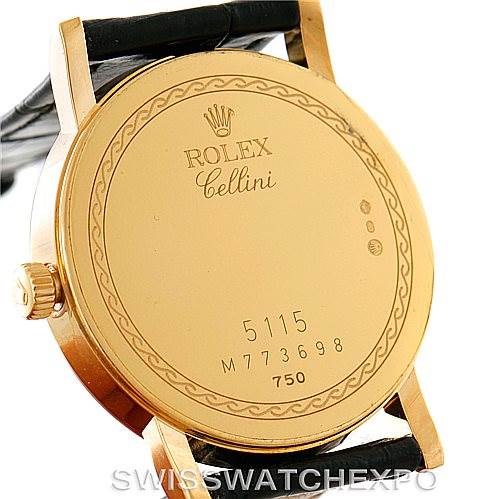 The image shows the back case of a Rolex Cellini 5115 Men
s Yellow Gold Champagne Dial 5115 Men
s Yellow Gold Champagne Dial watch, highlighting the brand, model name, and serial number.