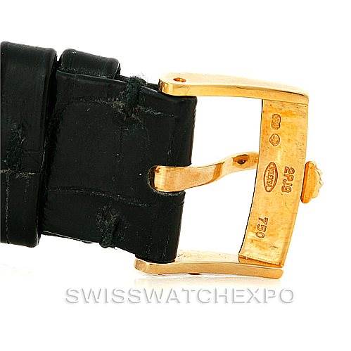 The image shows a close-up of the gold buckle and black leather strap of a Rolex Cellini 5115 Men
s Yellow Gold Champagne Dial 5115 Men
s Yellow Gold Champagne Dial watch.