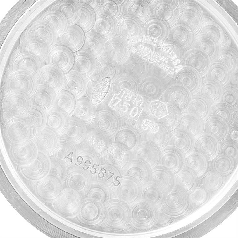 The image shows the inside of the case back for a Rolex Cellini 4233 Men
s White Gold Black Dial 4233 Men
s White Gold Black Dial watch, highlighting engravings and hallmarks on its surface.