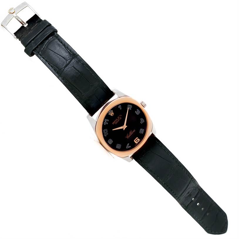 The image shows a top-down view of a Rolex Cellini 4233 Men
s White Gold Black Dial 4233 Men
s White Gold Black Dial watch, displaying its face, black leather strap, and buckle.
