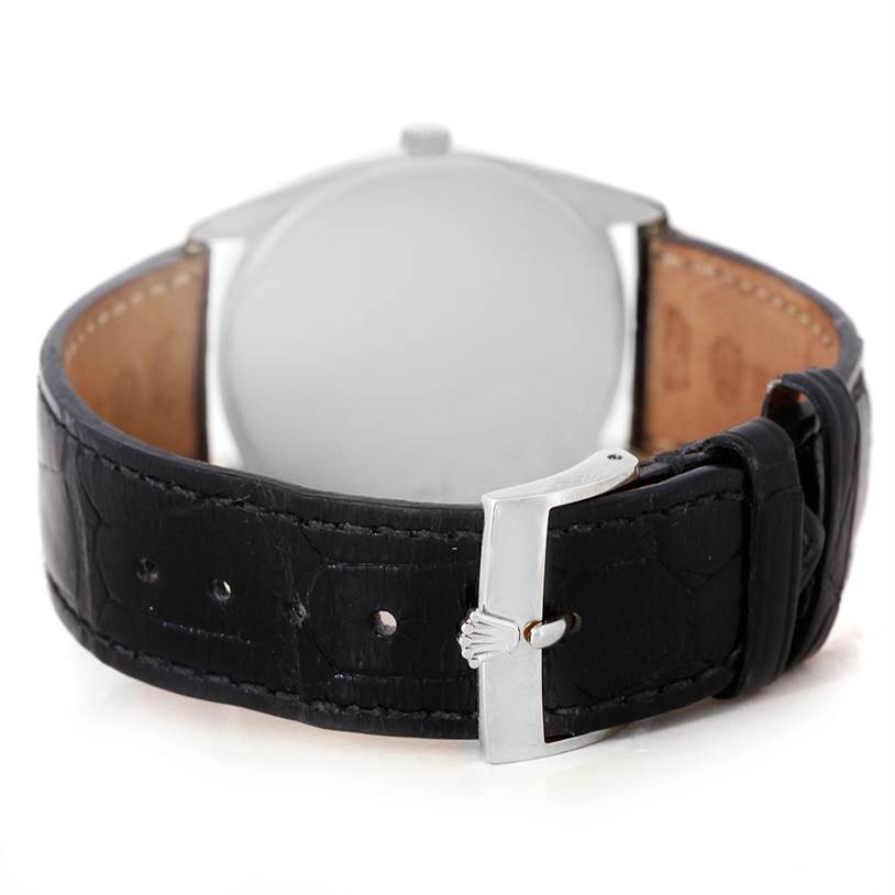 The image shows the back view of the Rolex Cellini 4233 Men
s White Gold Black Dial 4233 Men
s White Gold Black Dial watch, featuring the leather strap and buckle.