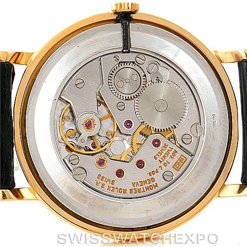 The image shows the back case of a Rolex Cellini 5112 Men's Yellow Gold White Dial 5112 Men's Yellow Gold White Dial model, highlighting its mechanical movement and internal components.