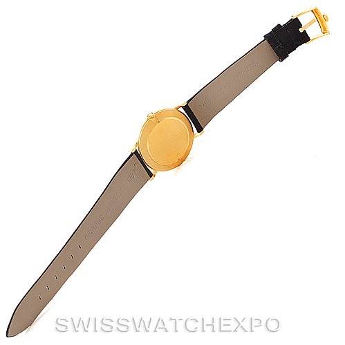 This image shows the back view of a Rolex Cellini 5112 Men's Yellow Gold White Dial 5112 Men's Yellow Gold White Dial watch, featuring its gold case and black leather strap.