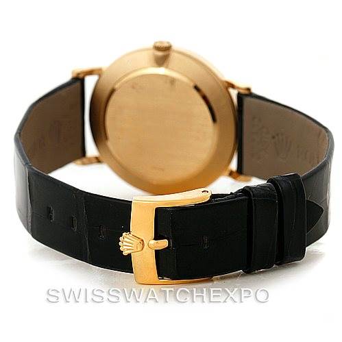 This image shows the back view of a Rolex Cellini 5112 Men's Yellow Gold White Dial 5112 Men's Yellow Gold White Dial watch, highlighting its case back, leather strap, and clasp.