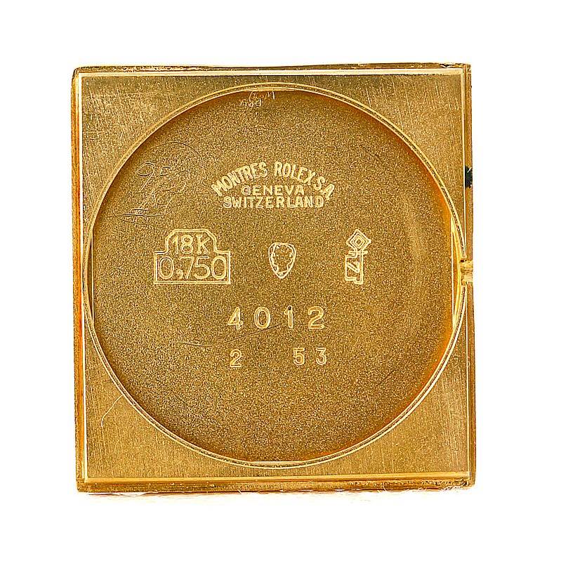 This image shows the inner case back of a Rolex Cellini 4012 Men's Yellow Gold Black Dial 4012 Men's Yellow Gold Black Dial watch, displaying hallmarks and model numbers.