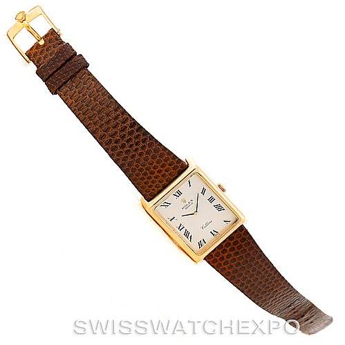 The image shows a top view of a Rolex Cellini 4105 Men's Yellow Gold Silver Dial 4105 Men's Yellow Gold Silver Dial watch with its brown leather strap and square gold case.