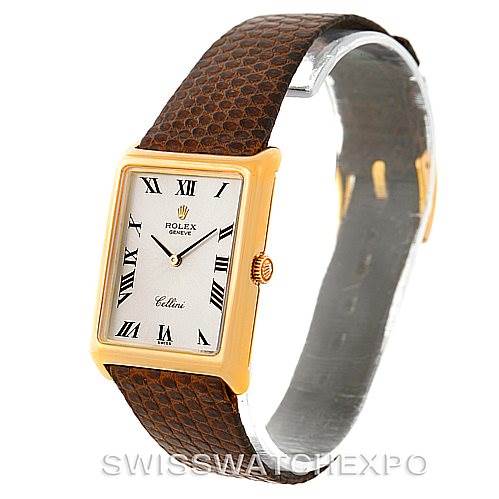 This image shows a Rolex Cellini 4105 Men's Yellow Gold Silver Dial 4105 Men's Yellow Gold Silver Dial watch at a three-quarter angle, highlighting its rectangular dial, brown leather strap, and gold case.