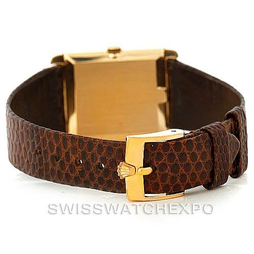 The image shows the buckle and rear view of the strap of a Rolex Cellini 4105 Men's Yellow Gold Silver Dial 4105 Men's Yellow Gold Silver Dial watch, highlighting its textured brown leather strap and gold clasp.