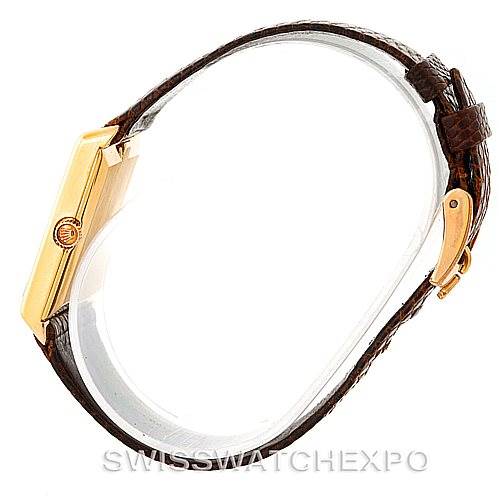 The image shows a side view of the Rolex Cellini 4105 Men's Yellow Gold Silver Dial 4105 Men's Yellow Gold Silver Dial watch, focusing on the gold case and the brown leather strap with the buckle.