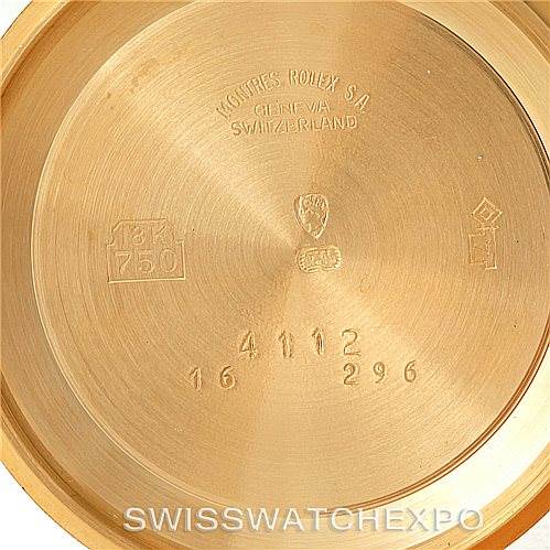 This image shows the inside of the case back of the Rolex Cellini 4112 Men's Yellow Gold Silver Dial 4112 Men's Yellow Gold Silver Dial watch, displaying various engravings and hallmarks.