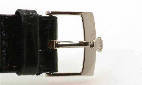 This image shows a close-up of the buckle and part of the strap of a Rolex Cellini 5115/9 Men
s White Gold Grey Dial 5115/9 Men
s White Gold Grey Dial model watch.