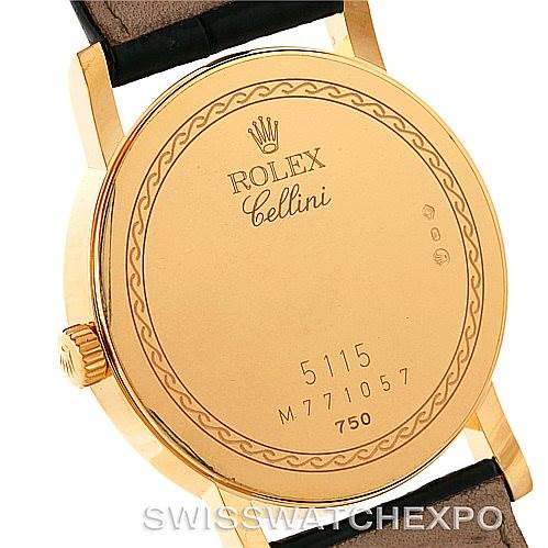 This is a rear view of the Rolex Cellini 5115 Men's Yellow Gold Beige Dial 5115 Men's Yellow Gold Beige Dial watch, showing the case back, crown, and part of the leather strap.