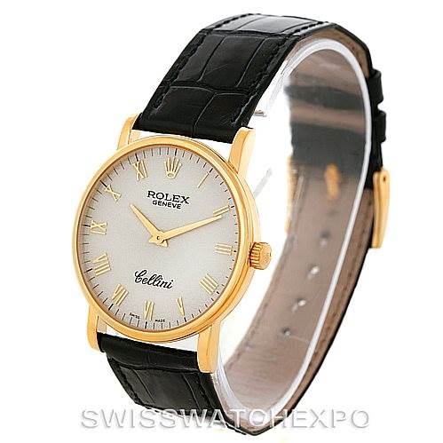 The image shows a Rolex Cellini 5115 Men's Yellow Gold Beige Dial 5115 Men's Yellow Gold Beige Dial watch from a front angle, highlighting its gold case, white dial, Roman numerals, and black leather strap.