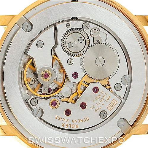 This image shows the back view of a Rolex Cellini 5115 Men's Yellow Gold Beige Dial 5115 Men's Yellow Gold Beige Dial watch, highlighting the intricate internal movement and gears.