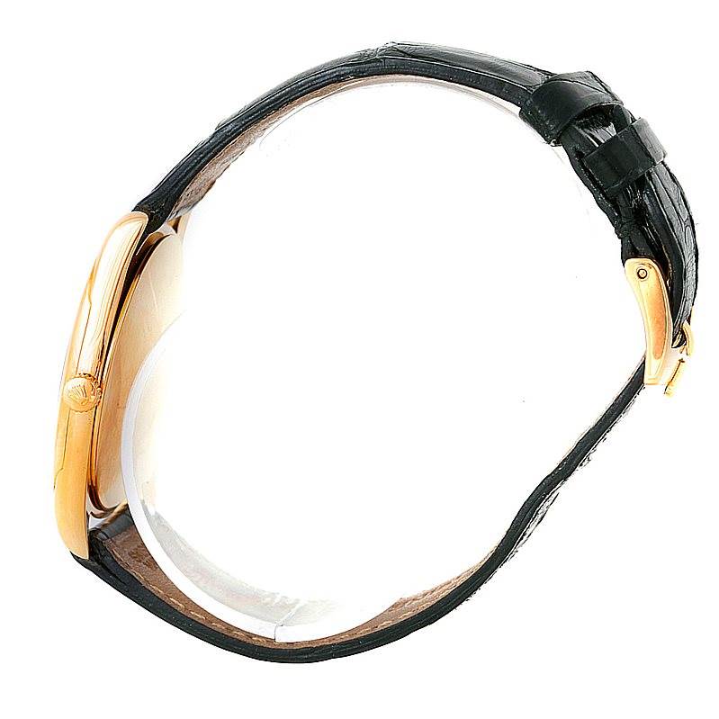 The image shows a side profile of a Rolex Cellini 4233 Men's Yellow Gold White Dial 4233 Men's Yellow Gold White Dial watch, focusing on the case, crown, and leather strap.