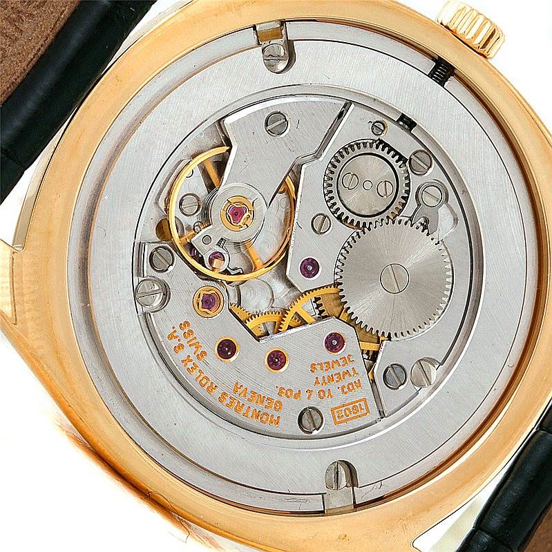The image shows the back of a Rolex Cellini 4233 Men's Yellow Gold White Dial 4233 Men's Yellow Gold White Dial watch, featuring its internal mechanical movement parts.
