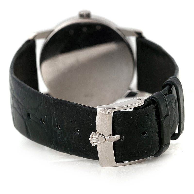 This image shows the back angle of the Rolex Cellini 5116 Men's White Gold Mother of Pearl Dial 5116 Men's White Gold Mother of Pearl Dial watch, highlighting its black leather strap and the clasp with the Rolex logo.