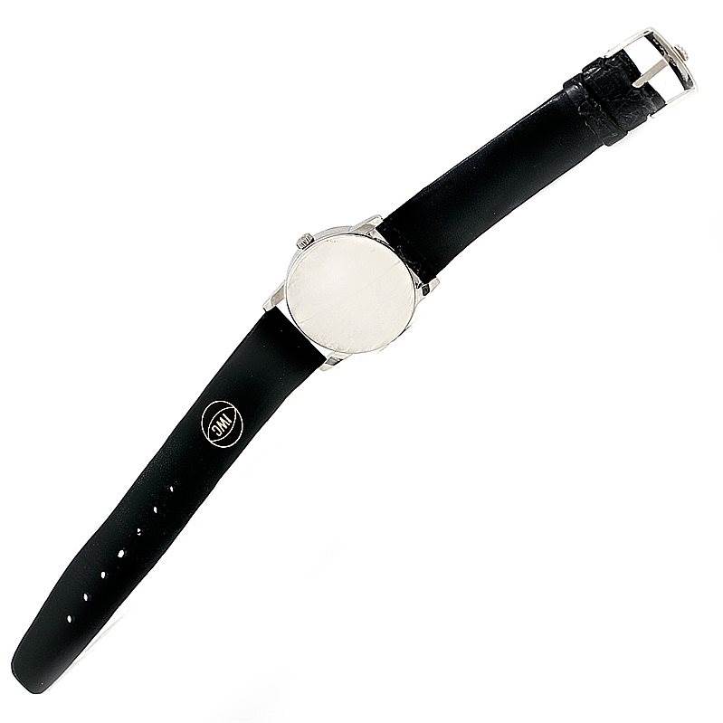 The Rolex Cellini 5116 Men's White Gold Mother of Pearl Dial 5116 Men's White Gold Mother of Pearl Dial watch is shown from an overhead angle, displaying the front face and entire leather strap.