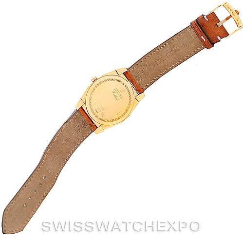 The image shows the back view of a Rolex Cellini 5330 Men's Yellow Gold White Dial 5330 Men's Yellow Gold White Dial watch with an open brown leather strap.