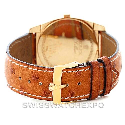 The image shows the back view of a Rolex Cellini 5330 Men's Yellow Gold White Dial 5330 Men's Yellow Gold White Dial watch, focusing on its leather strap and gold buckle.