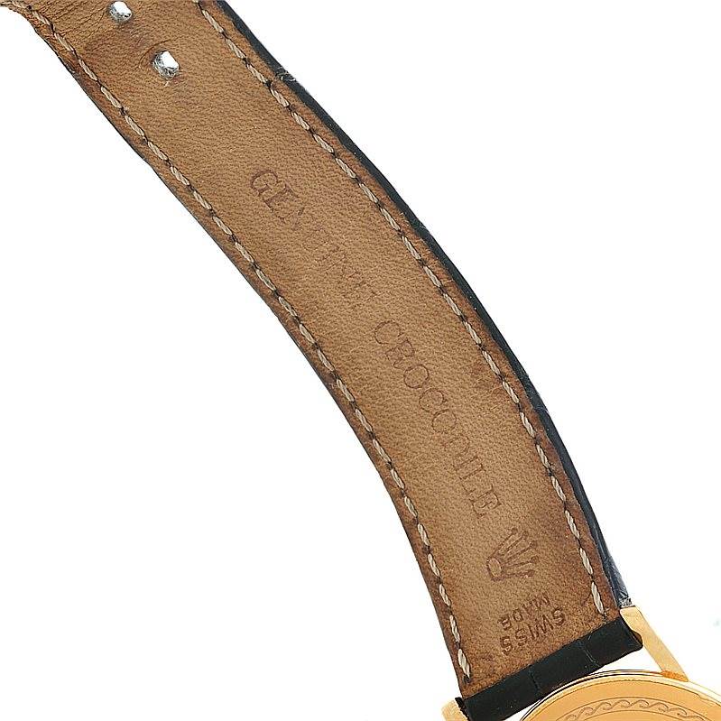 The image shows the inner side of the leather strap and part of the gold case of a Rolex Cellini 5115 Men's Yellow Gold Mother of Pearl Dial 5115 Men's Yellow Gold Mother of Pearl Dial watch.