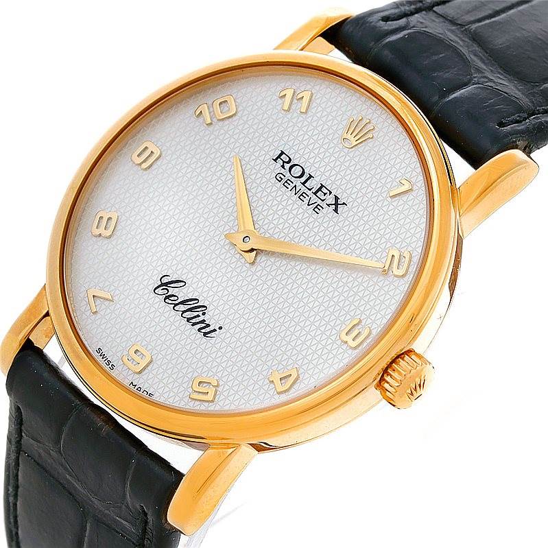 The image shows a close-up of the Rolex Cellini 5115 Men's Yellow Gold Mother of Pearl Dial 5115 Men's Yellow Gold Mother of Pearl Dial watch face, bezel, crown, and part of the leather strap at a slight angle.
