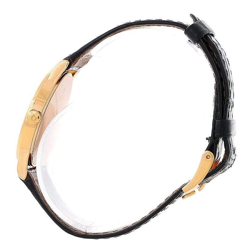 This image shows a side view of the Rolex Cellini 5115 Men's Yellow Gold Mother of Pearl Dial 5115 Men's Yellow Gold Mother of Pearl Dial watch, focusing on the crown, case, and leather strap with a clasp.