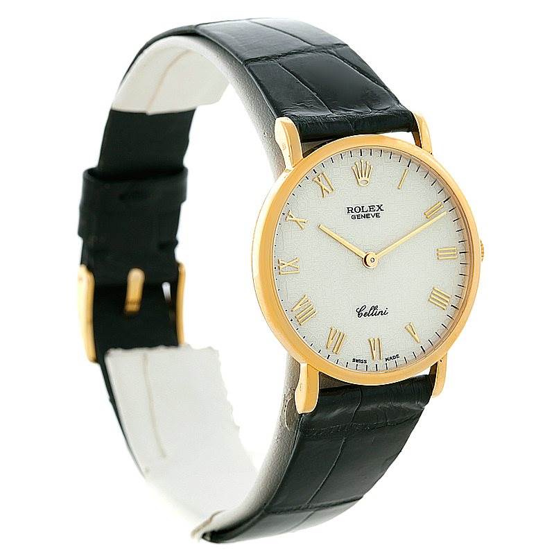 The watch in the image is a Rolex Cellini 5112 Men's Yellow Gold Beige Dial 5112 Men's Yellow Gold Beige Dial model, shown from an angled side view, featuring its face, strap, and buckle.