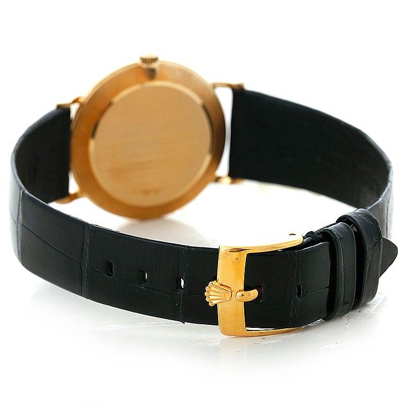 The image shows the back of a Rolex Cellini 5112 Men's Yellow Gold Beige Dial 5112 Men's Yellow Gold Beige Dial watch with emphasis on the leather strap and gold buckle.