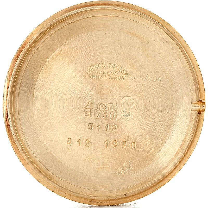 This image shows the inner case back of a Rolex Cellini 5112 Men's Yellow Gold Beige Dial 5112 Men's Yellow Gold Beige Dial watch, highlighting its stamps and engravings.