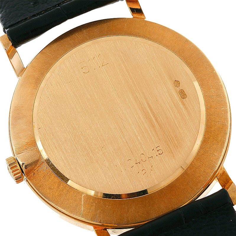 The image shows the back view of a Rolex Cellini 5112 Men's Yellow Gold Beige Dial 5112 Men's Yellow Gold Beige Dial watch, highlighting its gold case and lugs.