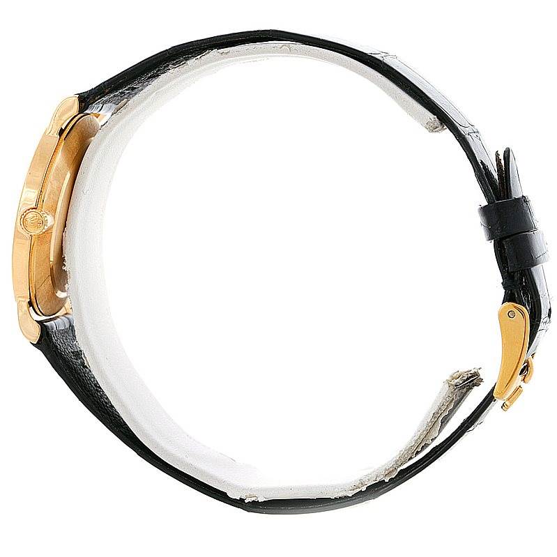 The Rolex Cellini 5112 Men's Yellow Gold Beige Dial 5112 Men's Yellow Gold Beige Dial watch is shown from a side view, highlighting the case, crown, and leather strap with buckle.