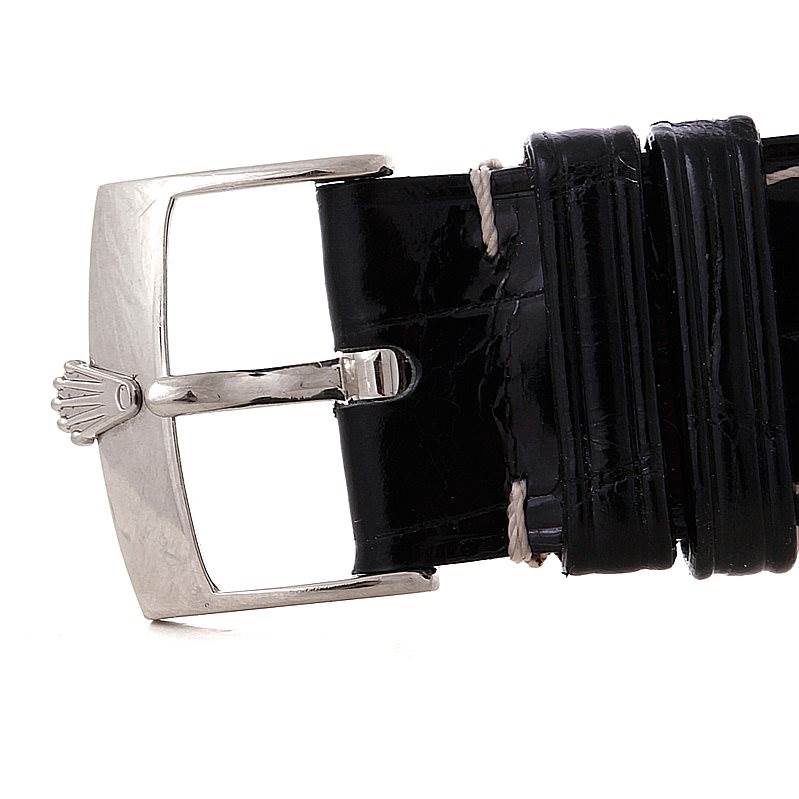 The image shows a close-up of the buckle and part of the leather strap of a Rolex Cellini 4233 Men's White Gold Black Dial 4233 Men's White Gold Black Dial watch.
