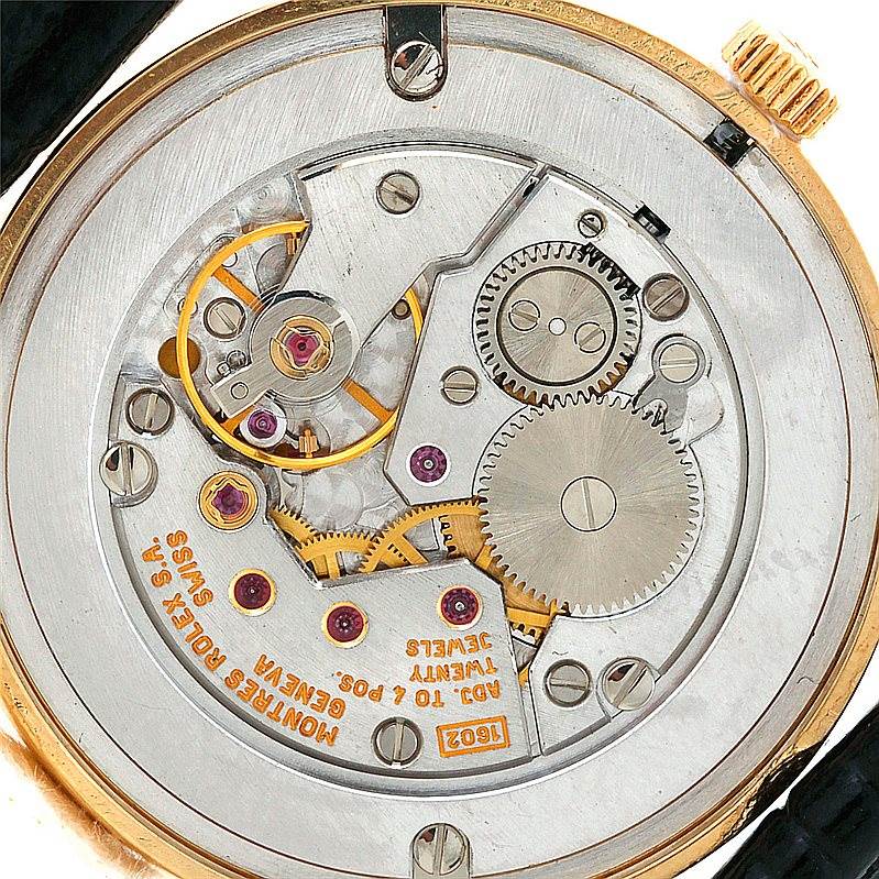 This image shows the intricate inner mechanical workings of a Rolex Cellini 5116 Men's Yellow Gold Silver Dial 5116 Men's Yellow Gold Silver Dial watch from a top-down angle.
